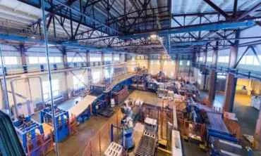 Large industrial warehouse with machinery and equipment.
